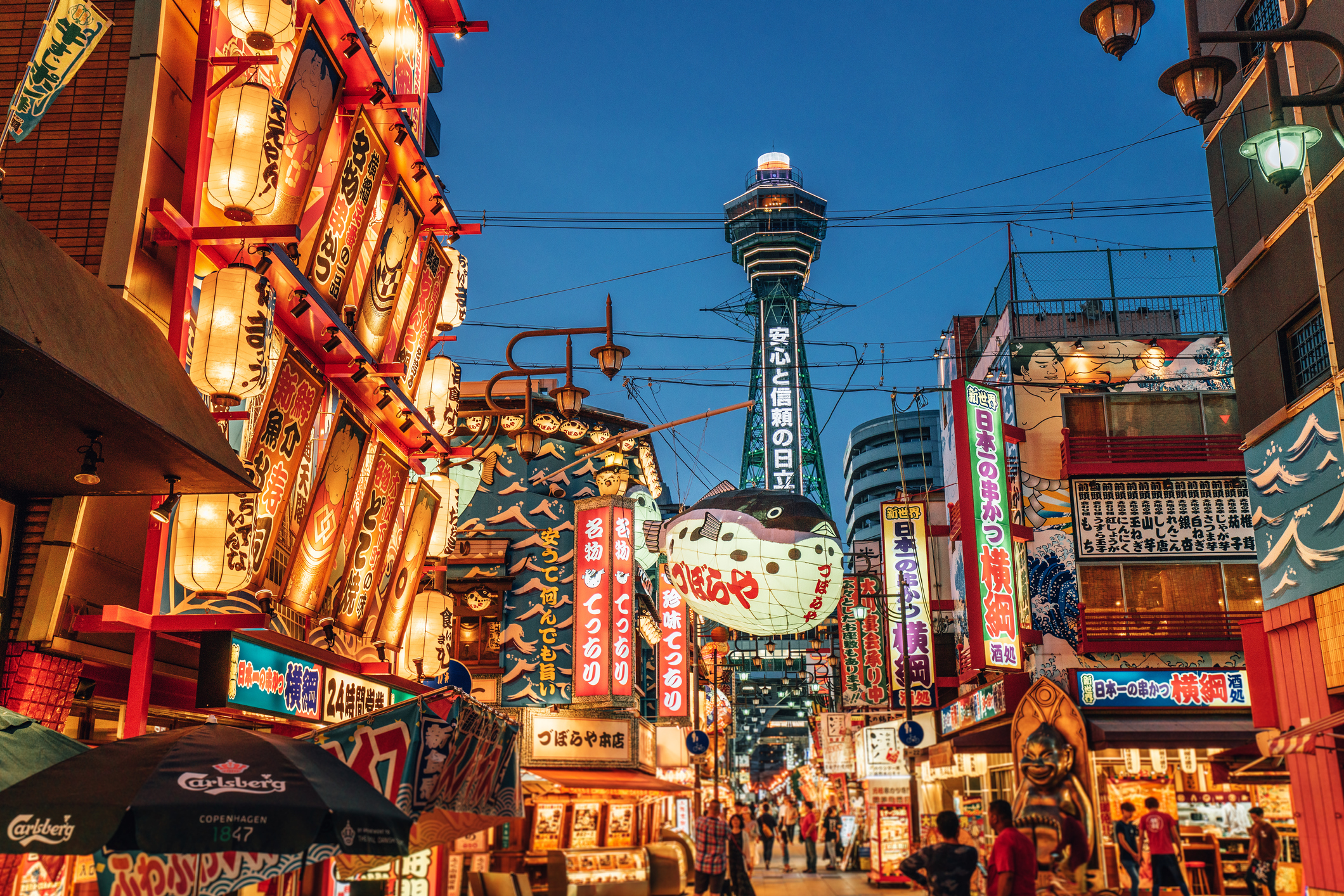 962650558 Osaka Tower and view of the neon advertisements Shinsekai district