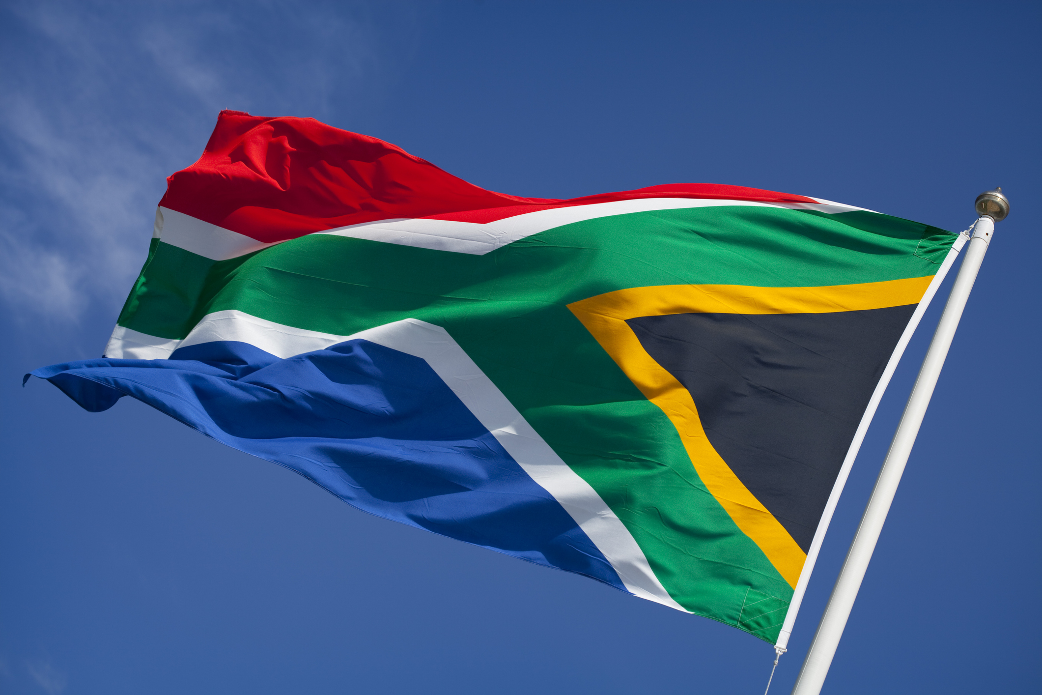 174682338 South African flag waving in the wind.