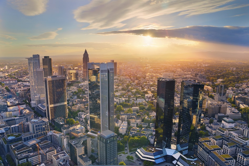 Aerial view of Frankfurt am Main skyline during golden hour.