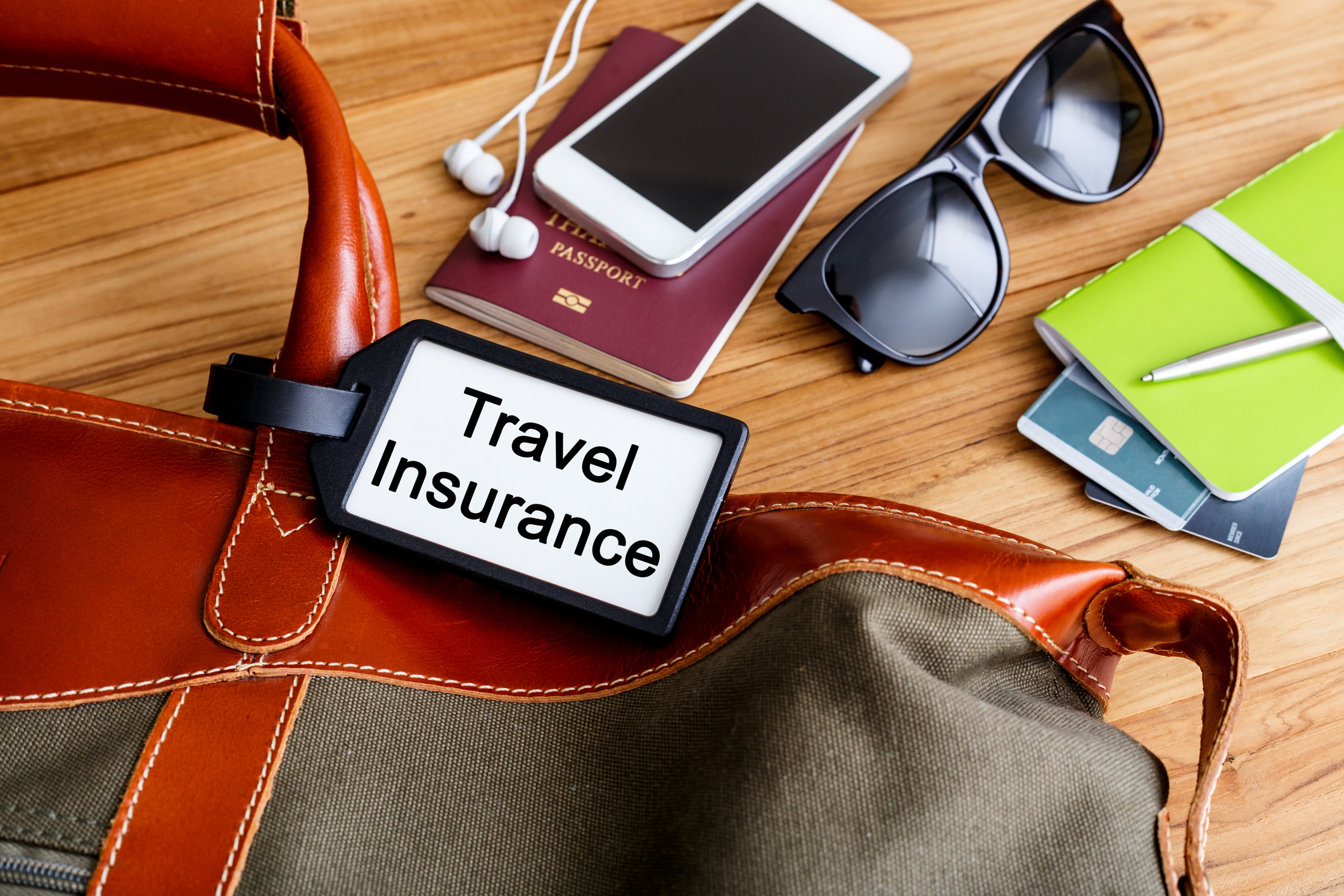 Travel bag with insurance tag and tourist accessories
